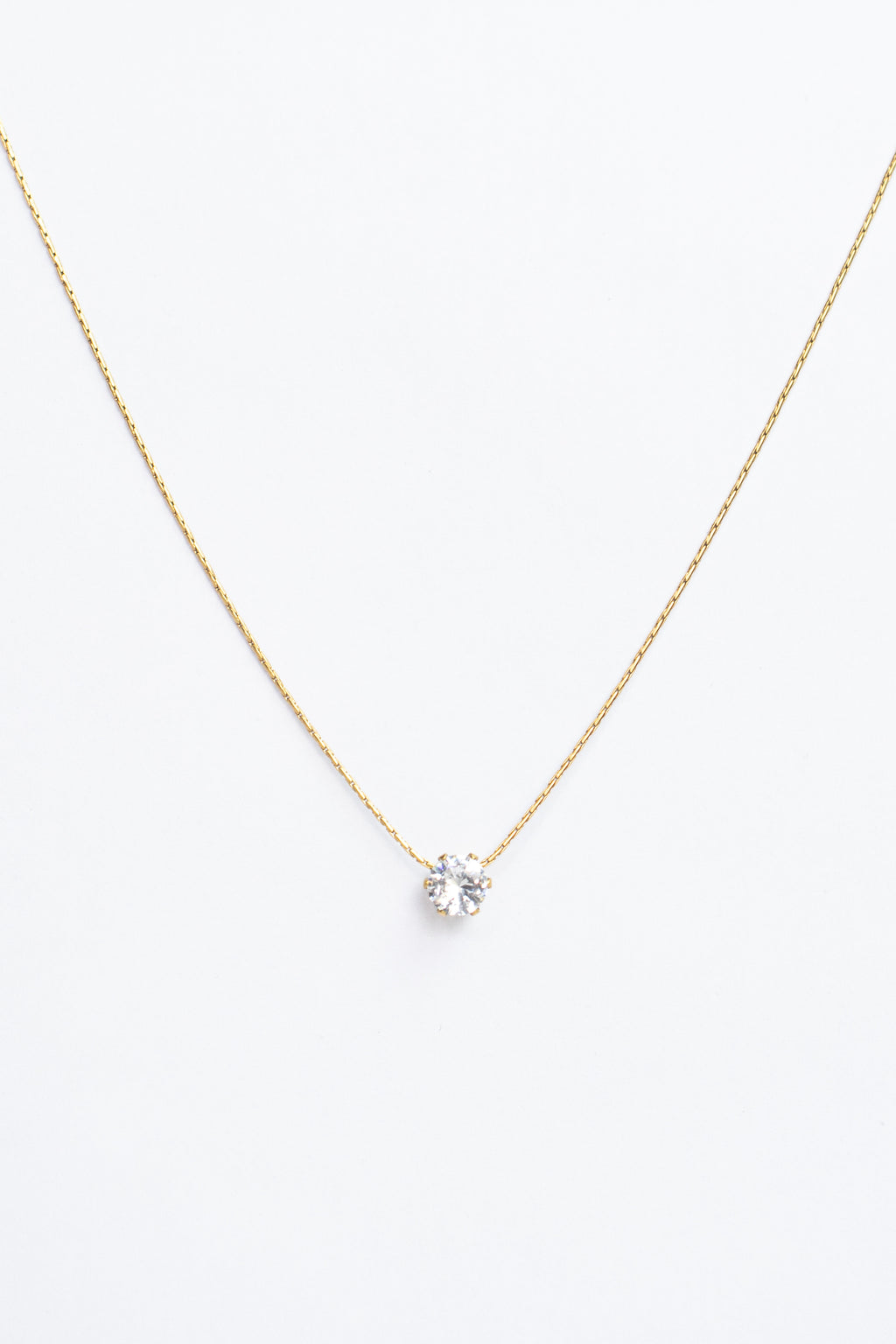 Gold necklace with a small pendant